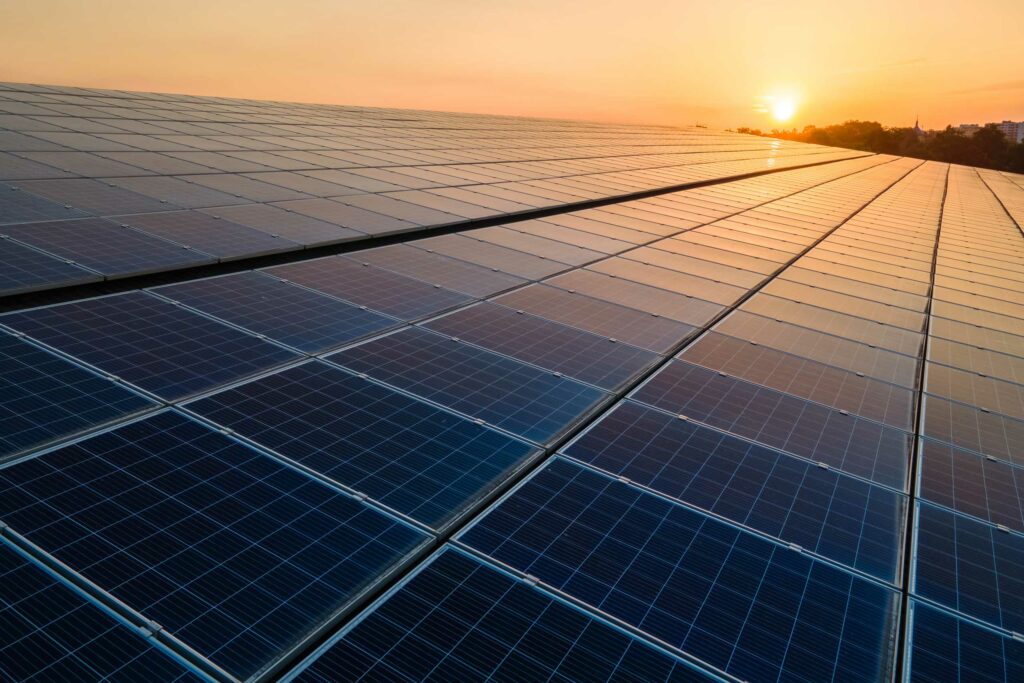 Ground mounted solar panels at sunset